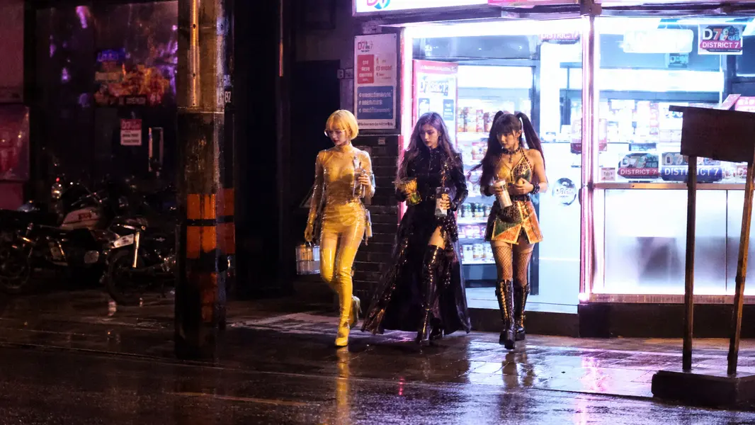 Burning Fruit Girls — Hami, Ning, Grape: STORE EXIT. Off-duty record at District 7 store front.